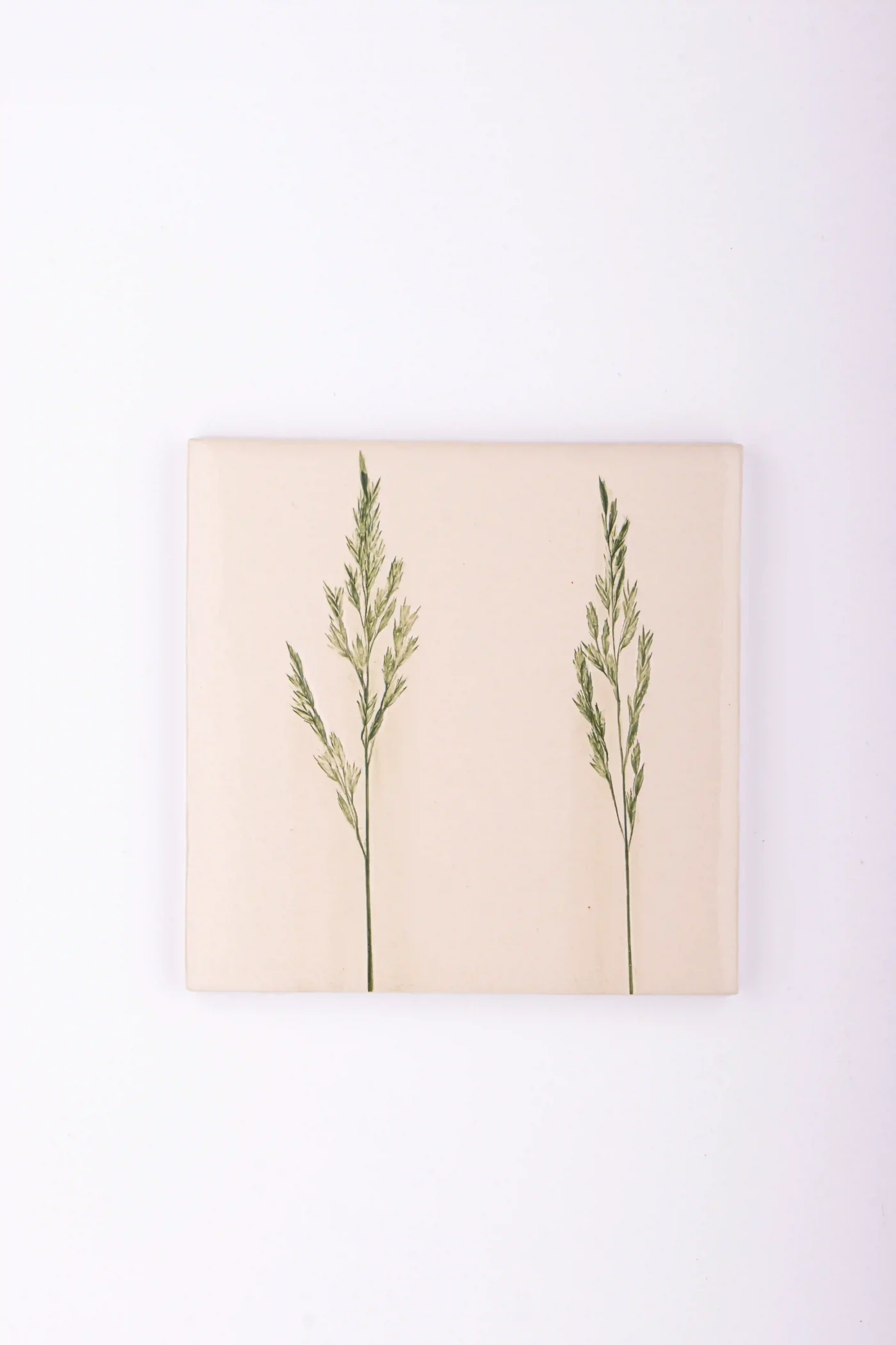 handmade tiles with green flower